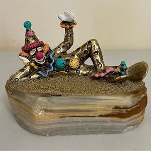 Ron Lee “Clown Pinky Laying Down” on Onyx Marble